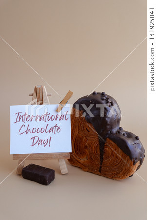 International Chocolate day saying caption on greeting card Delightful heartshaped pastry croissant treat, beautifully topped with colorful frosting galore. Copy space. Food experimentation viral 131925041