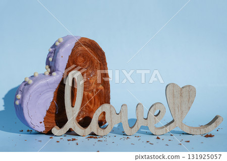 Wooden word LOVE decor Valentine's Day Birthday proposal holiday present gift idea Delightful and vibrant heartshaped pastry croissant treat, beautifully topped with colorful frosting galore. Copy 131925057