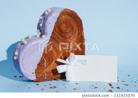 Empty paper note card template mock up Heart shaped blueberry flavor croissant on blue background with copy space. Puff pastry new trendy sweet dessert bakery. Creamy dough Empty paper note card template mock up Heart shaped blueberry flavor croissant on blue background with copy space. Puff pastry new trendy sweet dessert bakery. Creamy dough 131925070