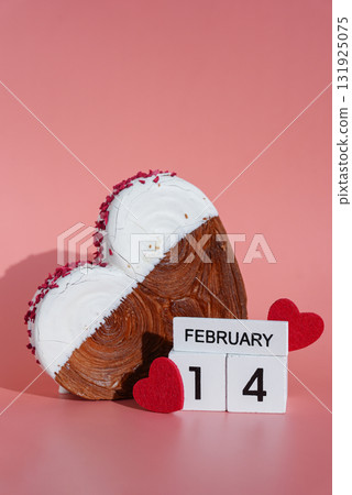 Valentine's Day 14 February wooden calendar cubes wishes greeting holiday card Heartshaped pastry croissant treat topped with colorful frosting galore. Food experimentation viral dessert baking trend Valentine's Day 14 February wooden calendar cubes wishes greeting holiday card Heartshaped pastry croissant treat topped with colorful frosting galore. Food experimentation viral dessert baking trend 131925075