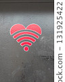 Heart symbol with Wi-Fi signal waves in red color on a dark background, representing connectivity and love in a modern digital age, ideal for technology and relationship themes 131925422