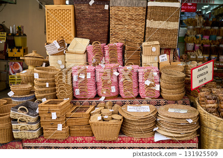 A shop display showcases a variety of handcrafted wicker baskets in different shapes, sizes, and designs, perfect for shopping and home decor. A shop display showcases a variety of handcrafted wicker baskets in different shapes, sizes, and designs, perfect for shopping and home decor. 131925509