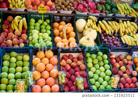 A vibrant display of fresh fruits at a market, showcasing a variety of produce, color, and texture. A vibrant display of fresh fruits at a market, showcasing a variety of produce, color, and texture. 131925511