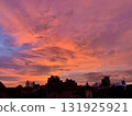 A vibrant sunset over Phnom Penh, Cambodia: A fantastical landscape where the city and nature coexist in harmony 131925921