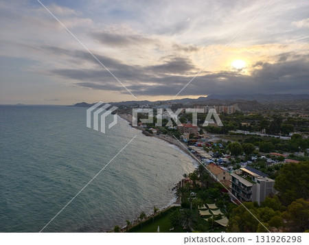 Enjoy a Serene and Beautiful Coastal Sunset View Over a Tranquil and Peaceful Beach Enjoy a Serene and Beautiful Coastal Sunset View Over a Tranquil and Peaceful Beach 131926298