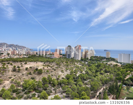 Enjoy the stunning coastal view of a vibrant city beautifully surrounded by rich nature Enjoy the stunning coastal view of a vibrant city beautifully surrounded by rich nature 131926336