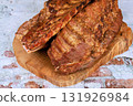 Juicy barbecue succulent smoked pork ribs seasoned perfectly placed on wooden board 131926984