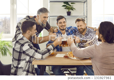 Happy bearded male friends drinking beer and eating pizza at the party at home. Happy bearded male friends drinking beer and eating pizza at the party at home. 131927361