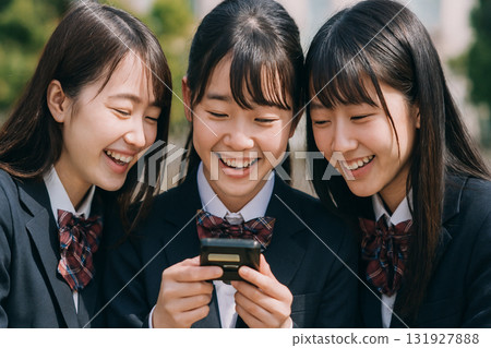 High school girl looking at pager 131927888