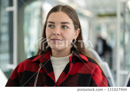 Girl sit in tram car, getting to work 131927994