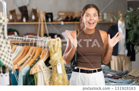 Happy smiling girl in clothing store. 131928163