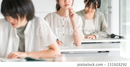 Elementary school children studying at cram schools, after-school programs, attending classes at school, and taking summer courses (Education) 131928292