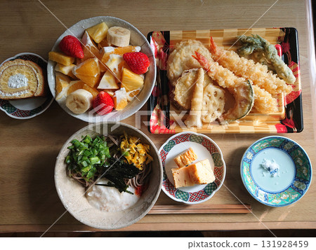 A classic Japanese dish: Tempura soba set (combination of prawn tempura and chilled grated yam soba noodles, small side dish, and fruit platter) A classic Japanese dish: Tempura soba set (combination of prawn tempura and chilled grated yam soba noodles, small side dish, and fruit platter) 131928459