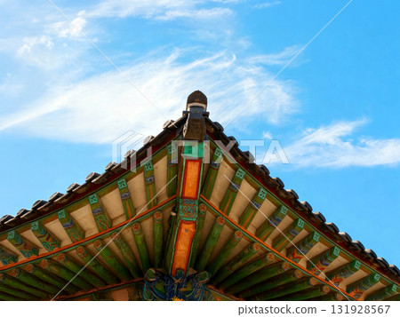 Traditional Korean Roof with Colorful Dancheong Patterns under Blue Sky 131928567