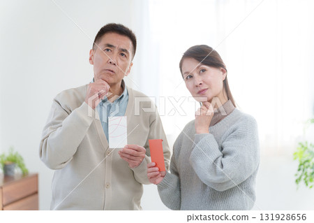 Grandparents giving New Year's gifts to their grandchildren 131928656