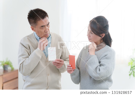 Grandparents giving New Year's gifts to their grandchildren Grandparents giving New Year's gifts to their grandchildren 131928657