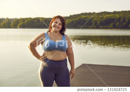 Portrait Of A Smiling Plus Size Woman In Sportswear 131928725