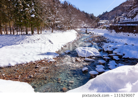 Snow piled river Snow piled river 131929007