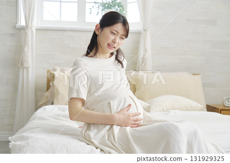 Pregnant woman with stomachache Pregnant woman with stomachache 131929325