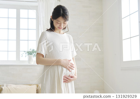 Pregnant woman portrait at home 131929329