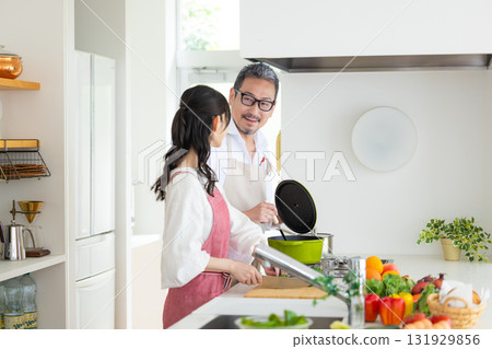 Kitchen: Middle-aged couple cooking 131929856