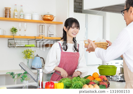 Kitchen: Middle-aged couple cooking 131930153