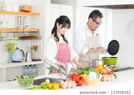Kitchen: Middle-aged couple cooking 131930381