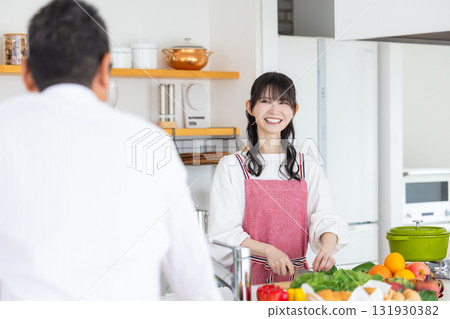 Kitchen: Middle-aged couple cooking Kitchen: Middle-aged couple cooking 131930382