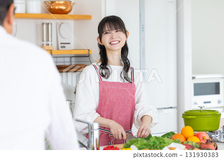 Kitchen: Middle-aged couple cooking Kitchen: Middle-aged couple cooking 131930383