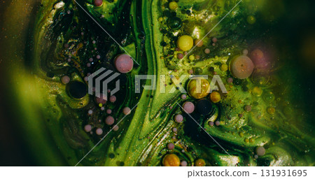 Defocused shiny bubbles. Colorful ink liquid. Green purple yellow glitter round oil texture floating on abstract art bokeh background. 131931695