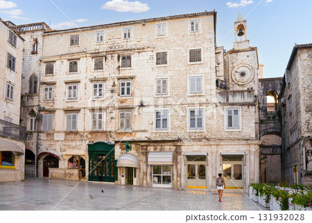 Woman walking through old city square in Split, Croatia 131932028
