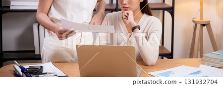 Two young asian businesswoman planning and strategy about marketing and financial. Two young asian businesswoman planning and strategy about marketing and financial. 131932704