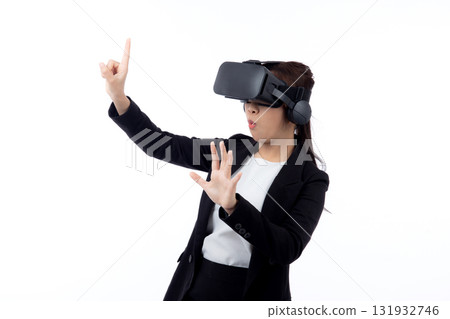 Portrait young asian businesswoman wearing headset virtual reality for device with experience. Portrait young asian businesswoman wearing headset virtual reality for device with experience. 131932746