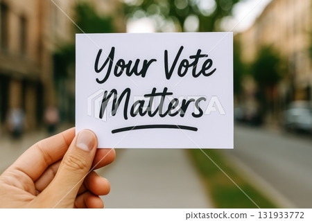Civic Engagement Action Hand Holding "Your Vote Matters" Card Urban Street Campaign Concept Blurred Background 131933772