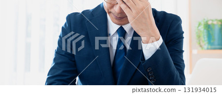 Worried middle-aged businessman Worried middle-aged businessman 131934015