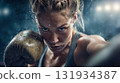A female boxer in worn leather gloves throws punches with fierce determination, intense training close-up under arena lights 131934387