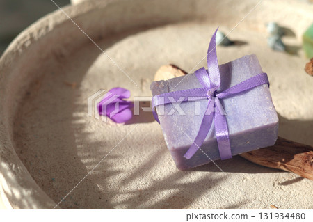 Cubes of natural soap against backdrop of natural elements. Handicrafts and hobbies. Cosmetics and beauty. Eco-friendly products. Background, composition for design. 131934480