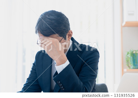 Worried middle-aged businessman Worried middle-aged businessman 131935526