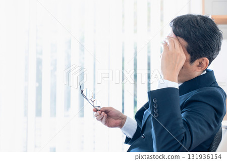 Worried middle-aged businessman Worried middle-aged businessman 131936154