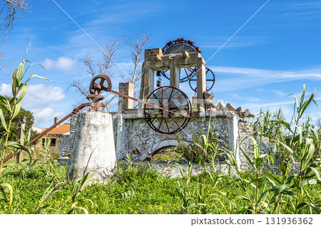 Old water mill at Ria Formosa national park at Faro, Portugal. 131936362