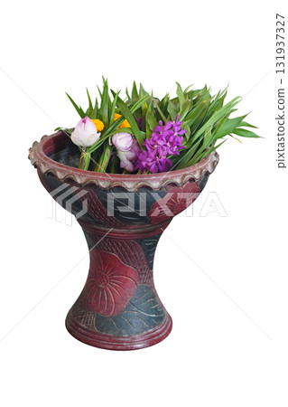 beautiful white and pink lotus and pink orchids flowers and marigold and green leaf placed in a red and black clay pot, on isolated background, nature, buddha, temple, copy space 131937327