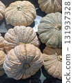 closeup large number of ripe pumpkins are placed on a black wooden floor, arranged in order, nature, food, vegetable, vitamin, copy space 131937328