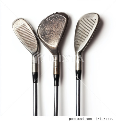 Set of three golf clubs on a white background for avid players and collectors showcasing various designs 131937749