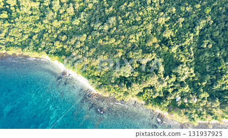 Koh Kood in Thailand. Aerial view of wave waters, white sandy beaches and rich forest nature Koh Kood in Thailand. Aerial view of wave waters, white sandy beaches and rich forest nature 131937925