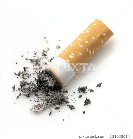 Cigarette stub resting on white surface surrounded by scattered ash after being extinguished 131938014