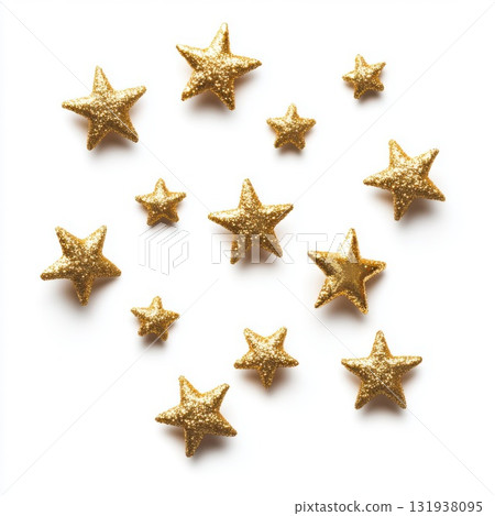 Shimmering gold stars arranged gracefully on a white background create a festive and decorative display for celebrations 131938095