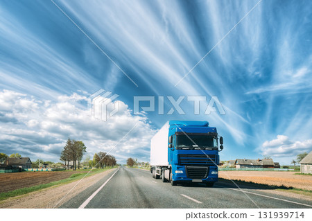 Truck On Country Road. Tractor Unit, Prime Mover, Traction Unit In Motion On Countryside Road In Europe. Business Transportation And Trucking Industry Concept 131939714