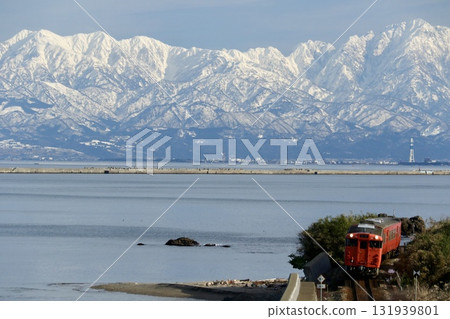 Himi Line runs with the Tateyama Mountain Range in the background Himi Line runs with the Tateyama Mountain Range in the background 131939801