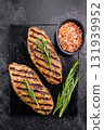 Grilled lula kebabs, perfect for an authentic Middle Eastern feast. black background. top view 131939952