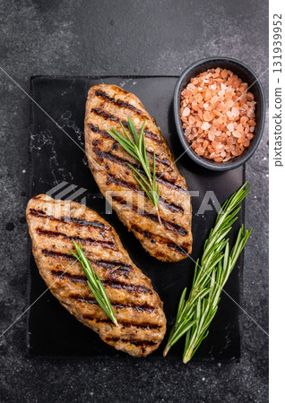 Grilled lula kebabs, perfect for an authentic Middle Eastern feast. black background. top view 131939952